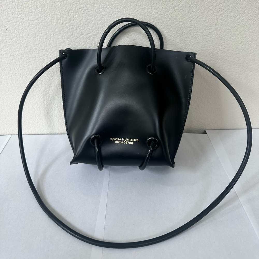 Kozha Numbers the Utility shoulder bag in black